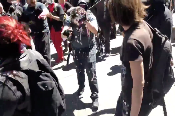 Andy Ngo (centre) in the centre of a Portland Antifa demonstration