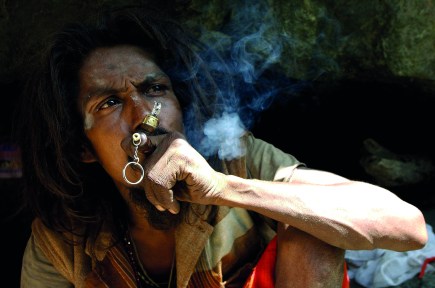 solitude A Hindu hermit smokes a pipe in the vill