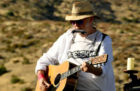 Neil Young performs at the Harvest Moon benefit