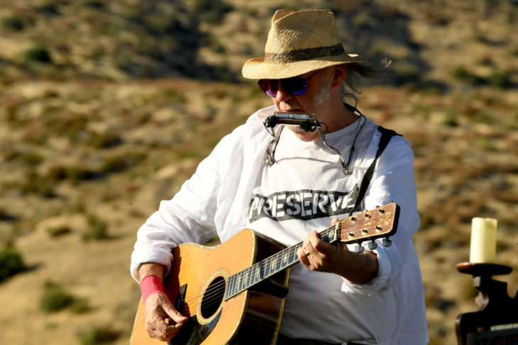 Neil Young performs at the Harvest Moon benefit