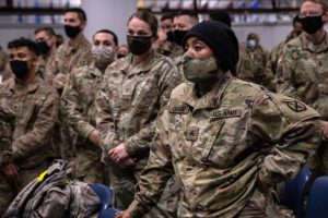 U.S. Army soldiers are briefed on COVID-19 quarantine procedures after returning home from a 9-month deployment to Afghanistan on December 10, 2020 (Photo by John Moore/Getty Images)