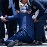 US President Joe Biden is helped up after falling during the graduation ceremony at the United States Air Force Academy (Getty Images)