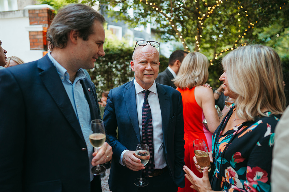 Toby Young drinking at The Spectator summer party